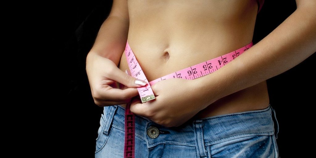 Woman measuring hips