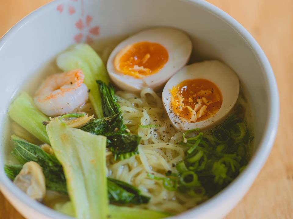 bowl of noodle soup with boiled eggs