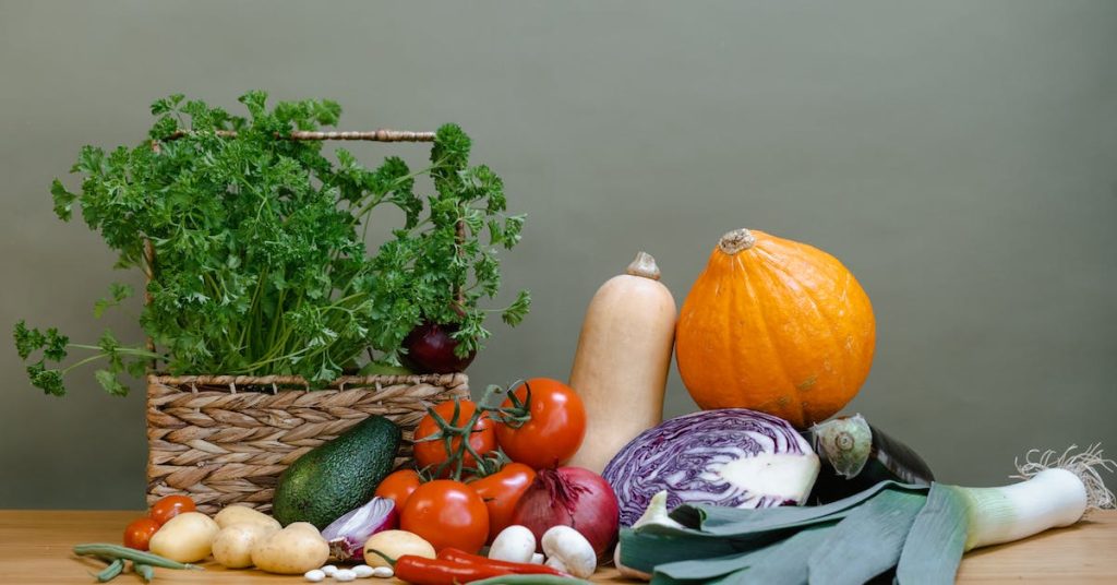 variety of fresh vegetables on a wooden table to prepare a potato salad